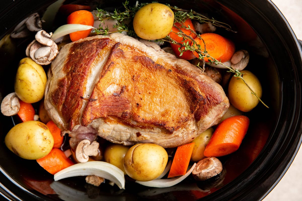 Ingredients for crock pot pork roast in a slow cooker, ready to cook.