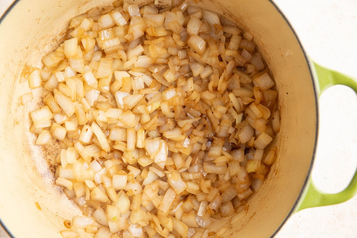 Onions sautéing in a Dutch oven