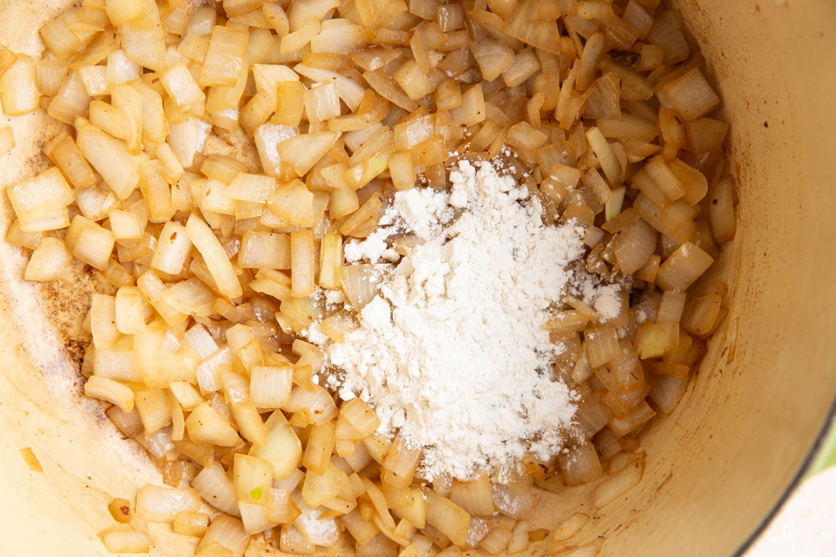 Flour and onions in a large pot.