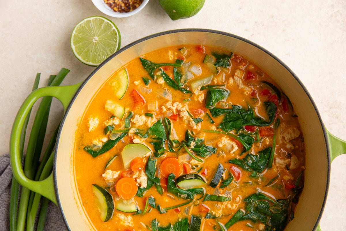 large pot of ground turkey Thai curry soup with vegetables, ready to serve.