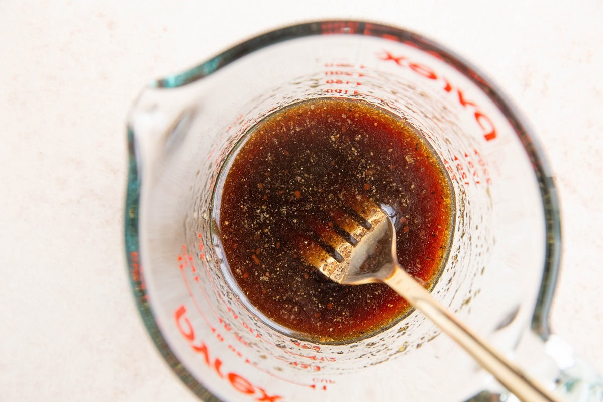 Sesame sauce in a measuring cup for sesame chicken.