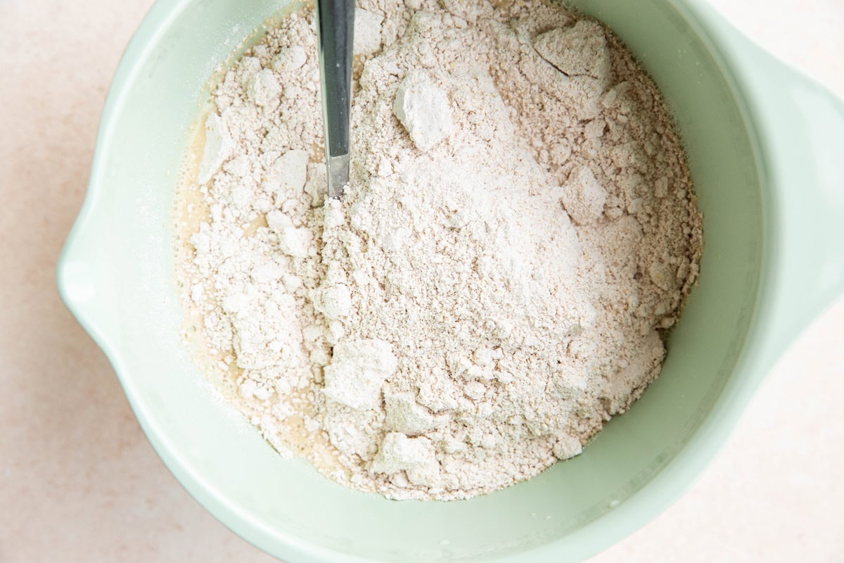 Dry mixture on top of wet mixture in a mixing bowl.