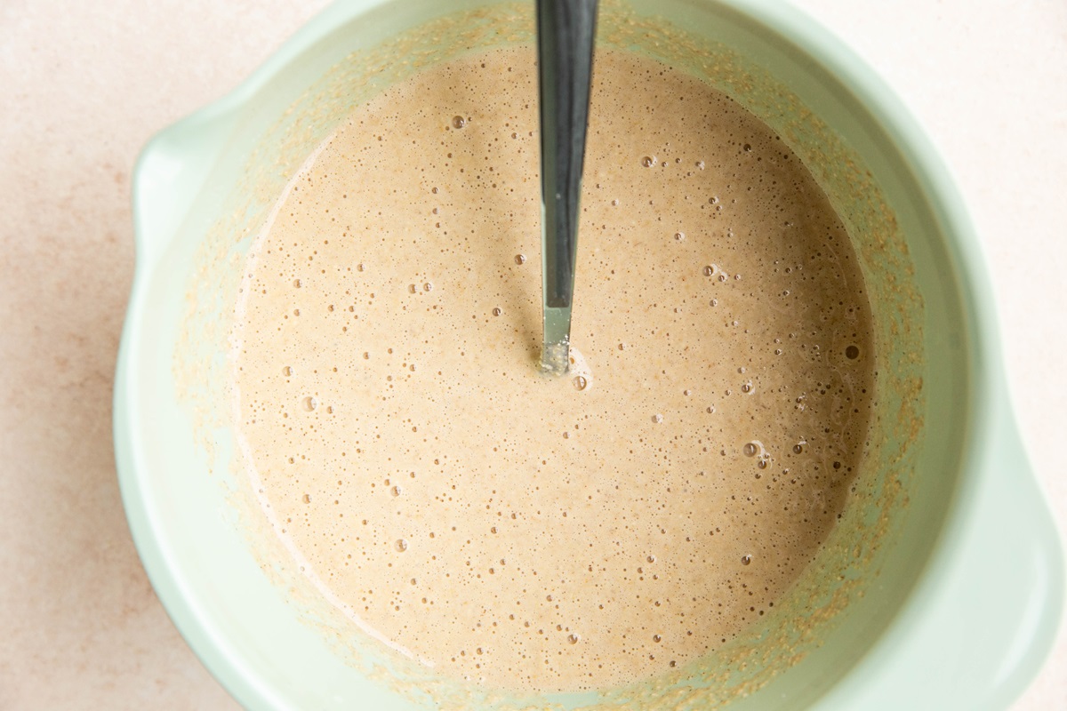 Oatmeal pancake batter in a mixing bowl.