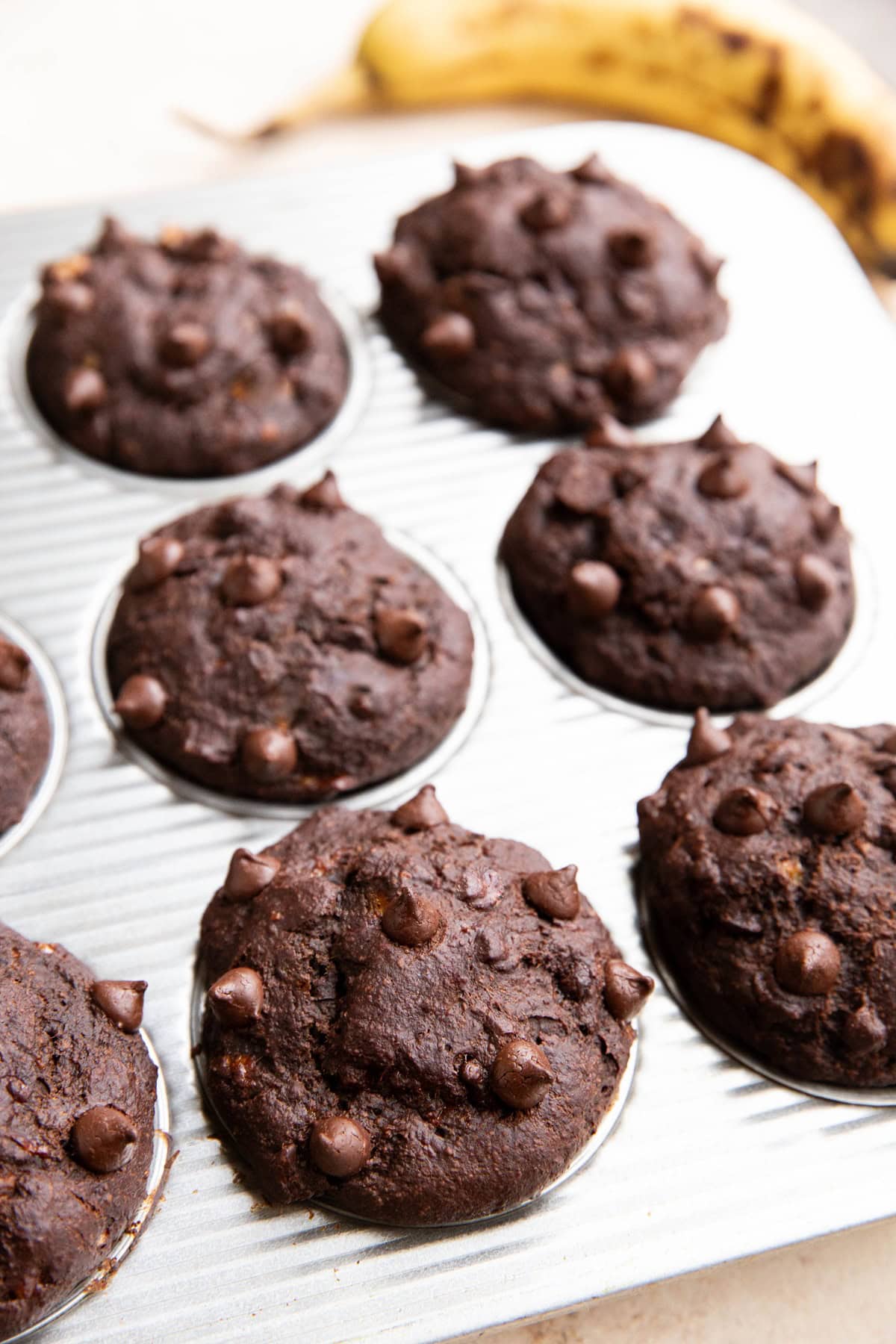 Muffin pan of chocolate chip banana oatmeal muffins