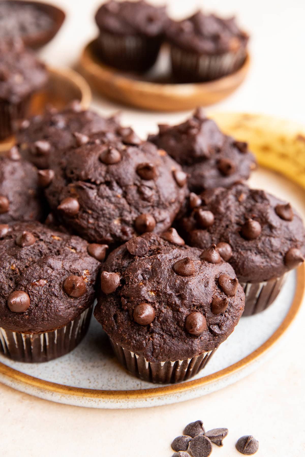 Plate full of chocolate chip oatmeal banana muffins.