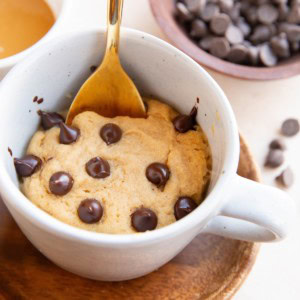 Mug with peanut butter cake inside for a single serve dessert.