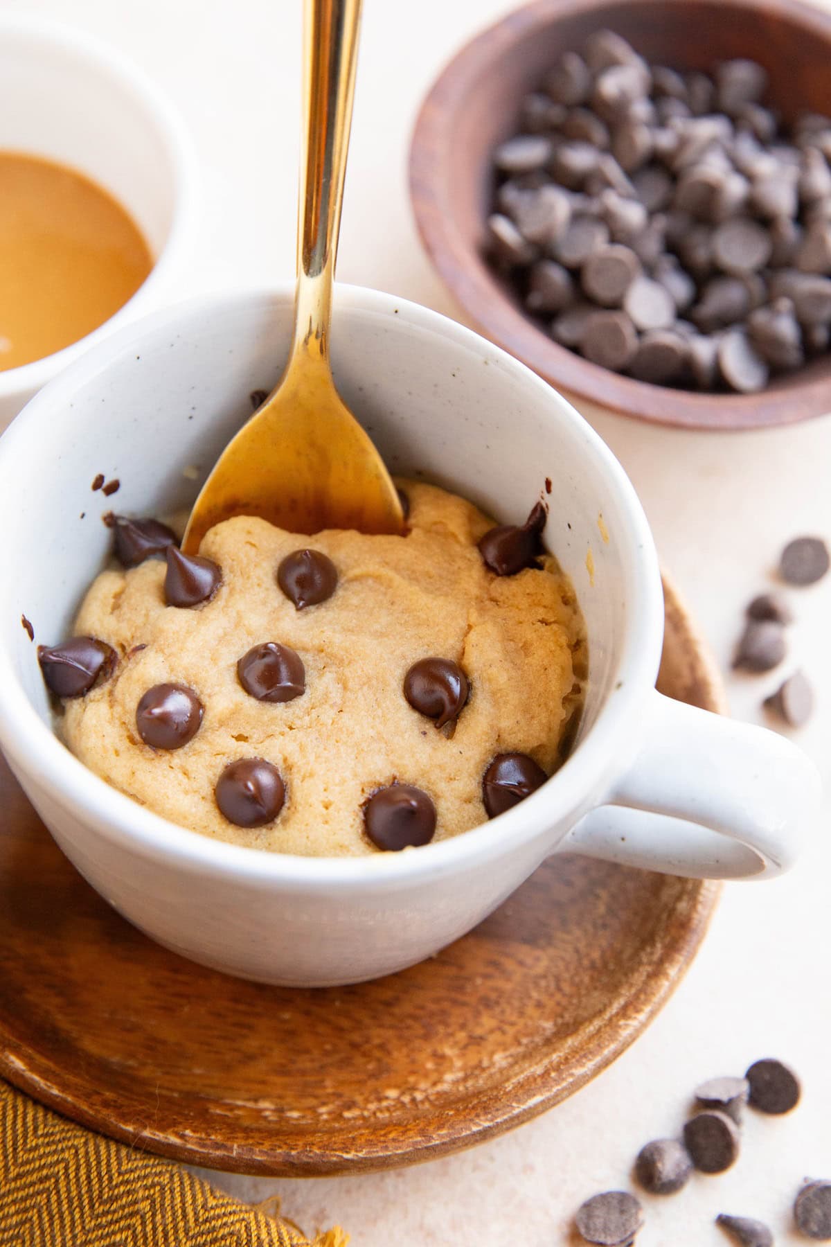 Mug with peanut butter cake inside for a single serve dessert.