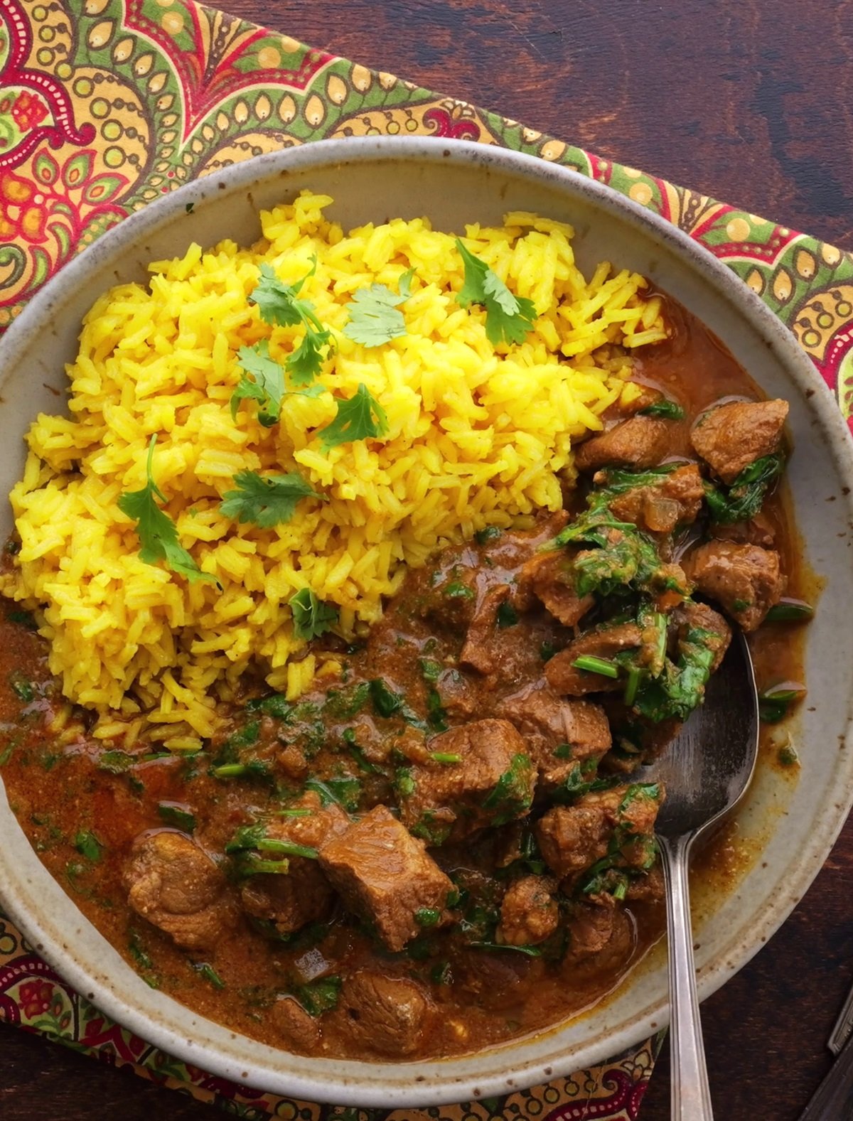 Big bowl of lamb curry with saffron rice.