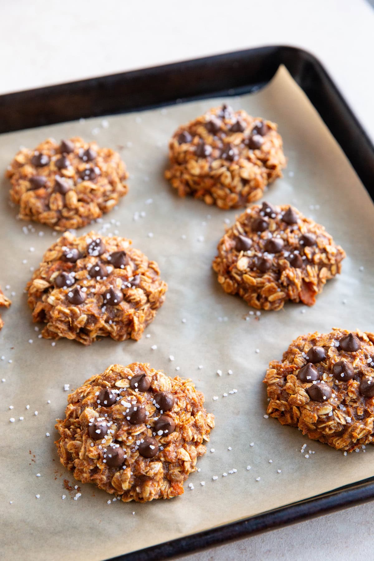 Baking sheet of sweet potato oatmeal cookies fresh out of the oven.