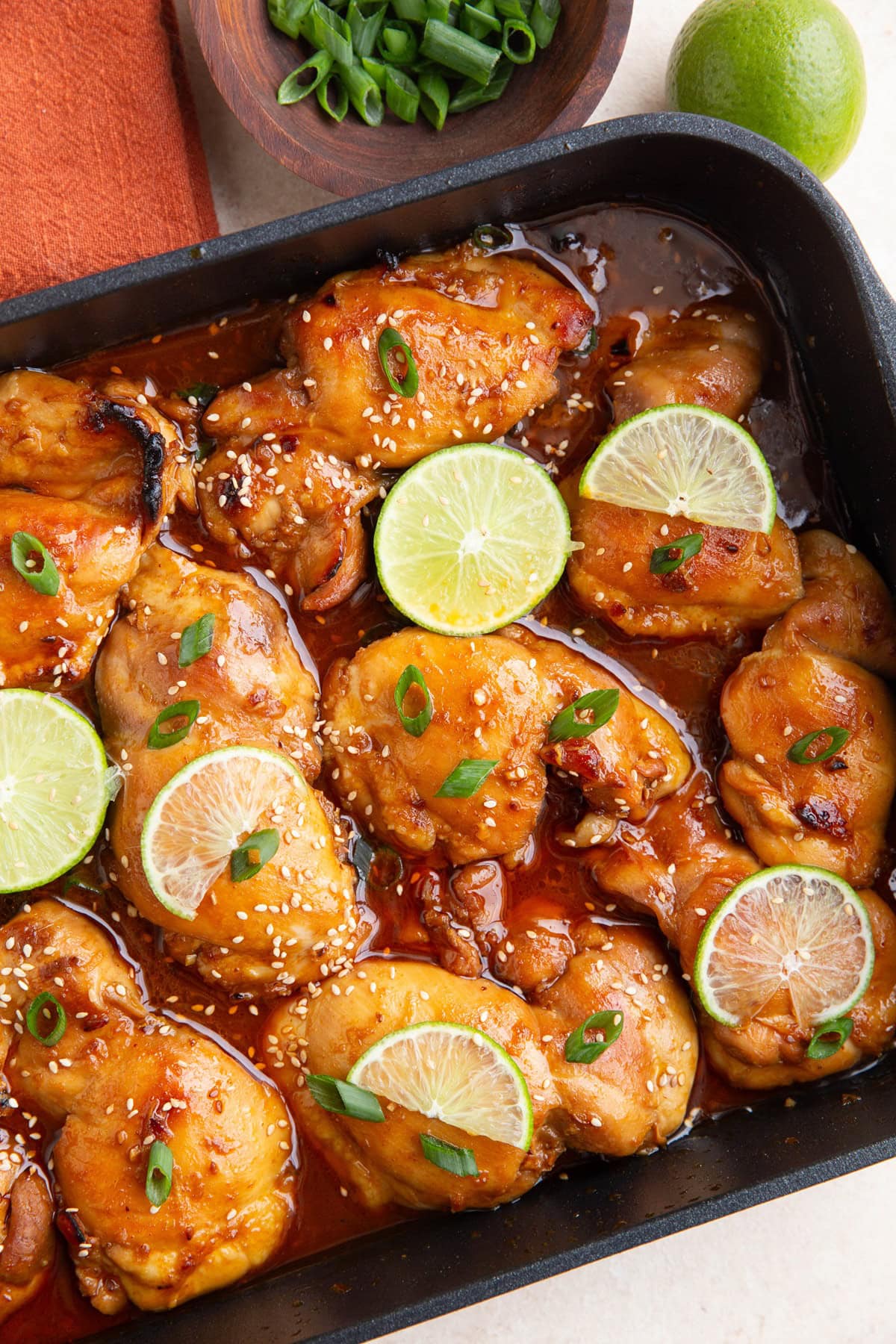 Roasting pan full of Korean BBQ chicken.