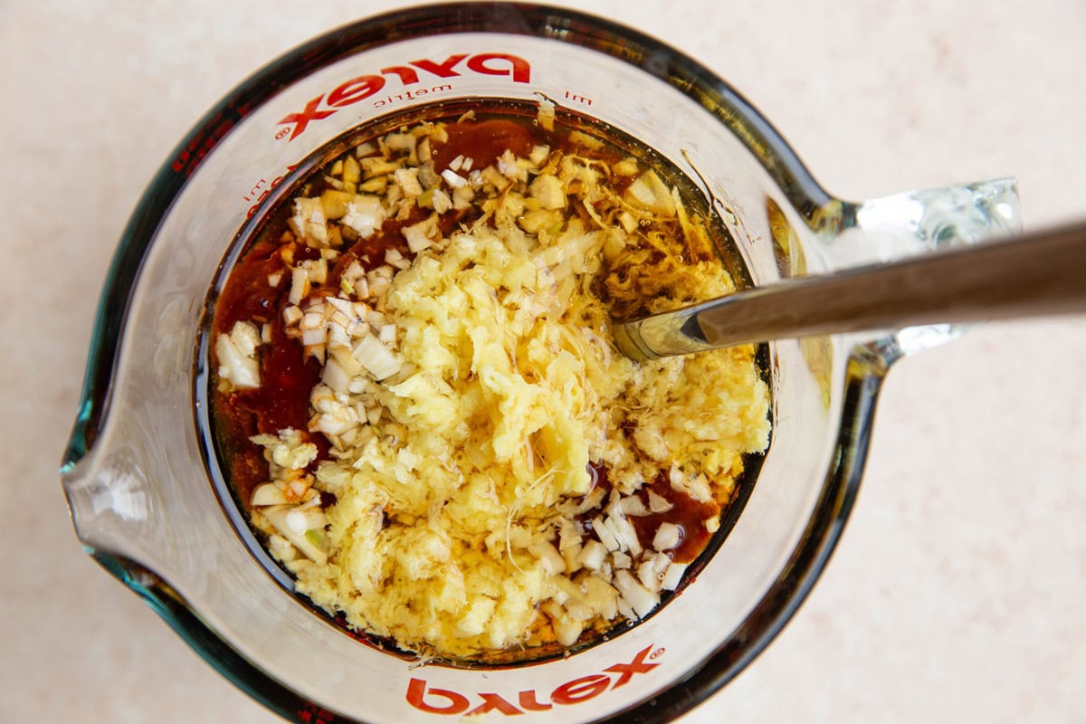 Ingredients for Korean bbq sauce in a measuring cup, ready to stir together.