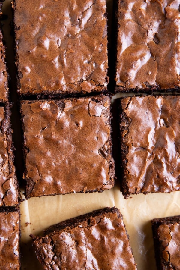 Gluten-free brownies with shiny crackle top, cut into slices.