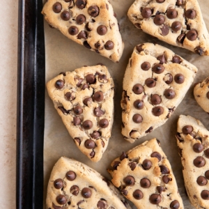 Baking sheet of chocolate chip scones, ready to eat.