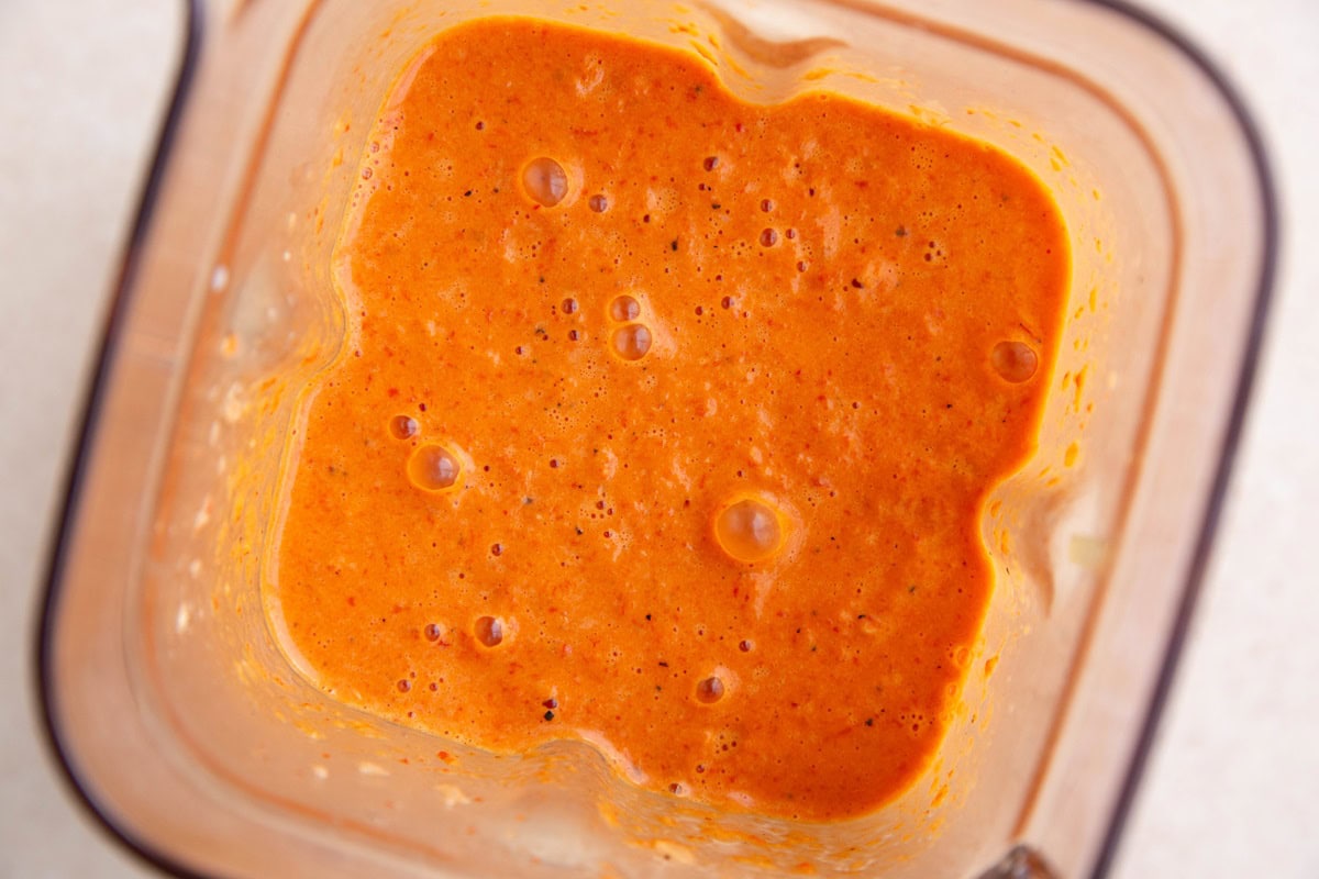 Creamy roasted pepper sauce in a blender, ready to use.