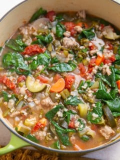 large pot of soup with ground turkey and vegetables, ready to eat.