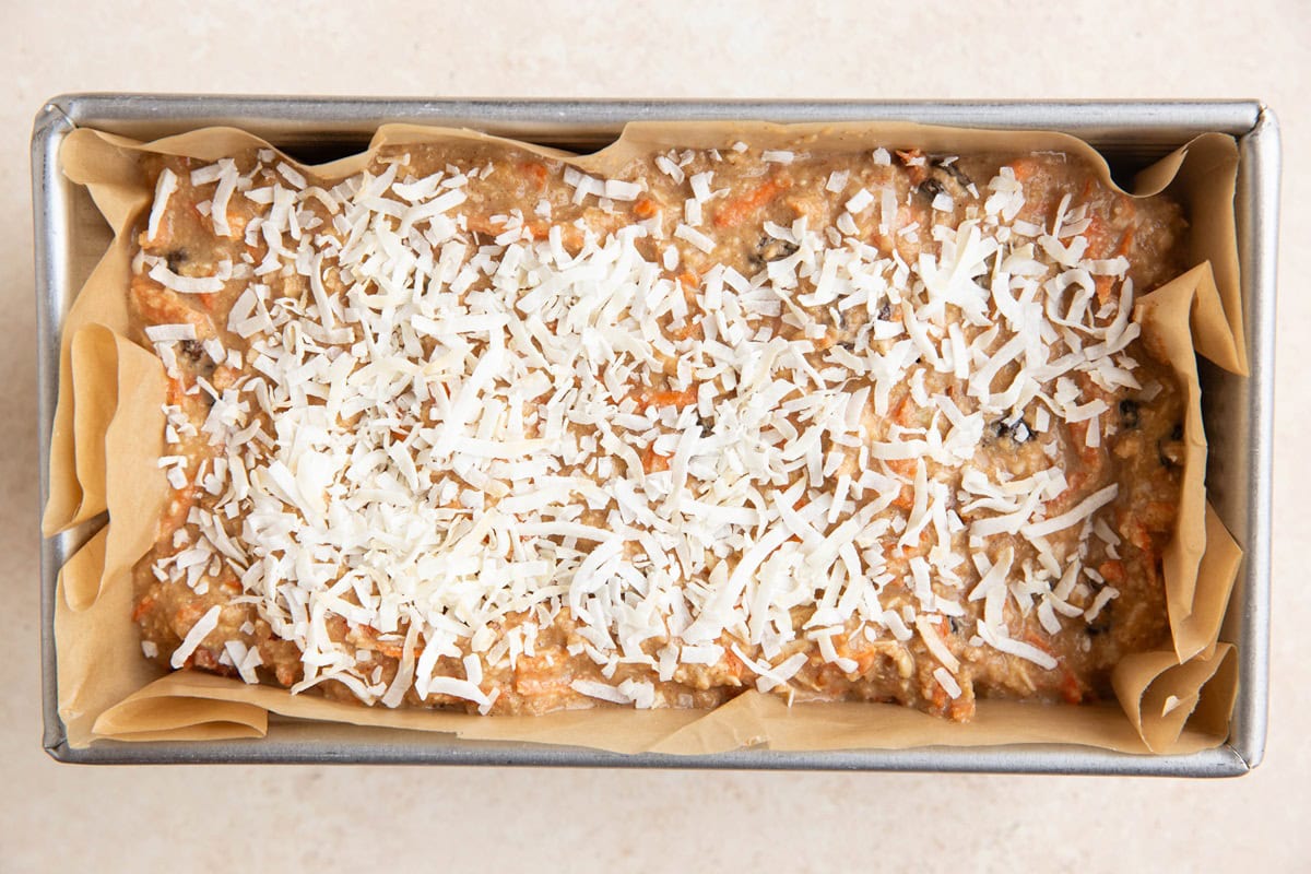 Loaf pan of carrot cake bread batter ready to go into the oven.