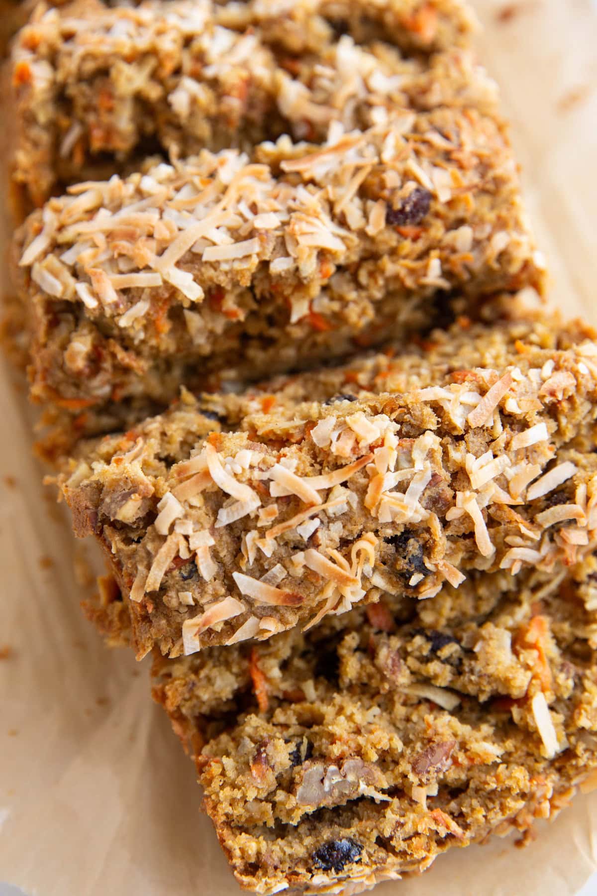 Loaf of carrot cake bread cut into slices.