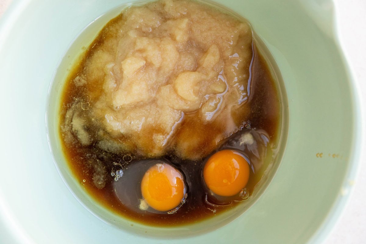 Wet ingredients for muffins in a mixing bowl.