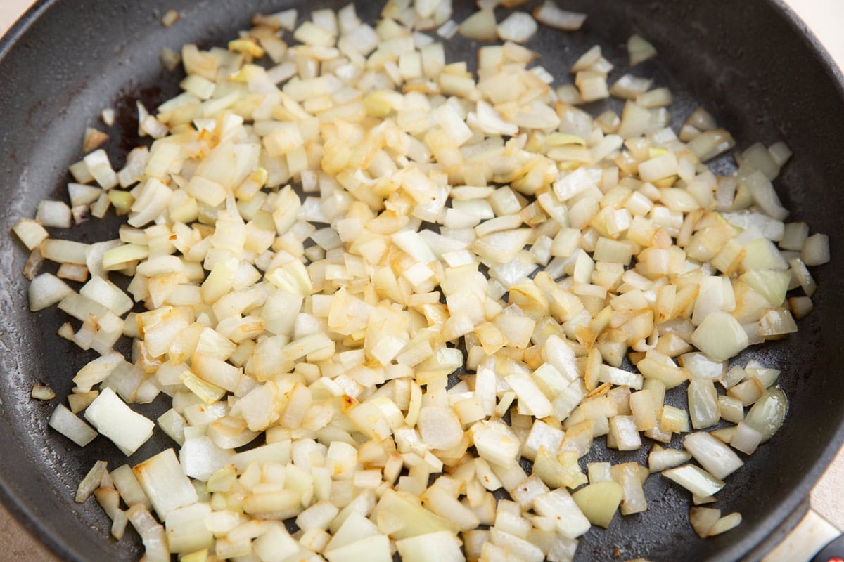 Onions sautéing in a skillet