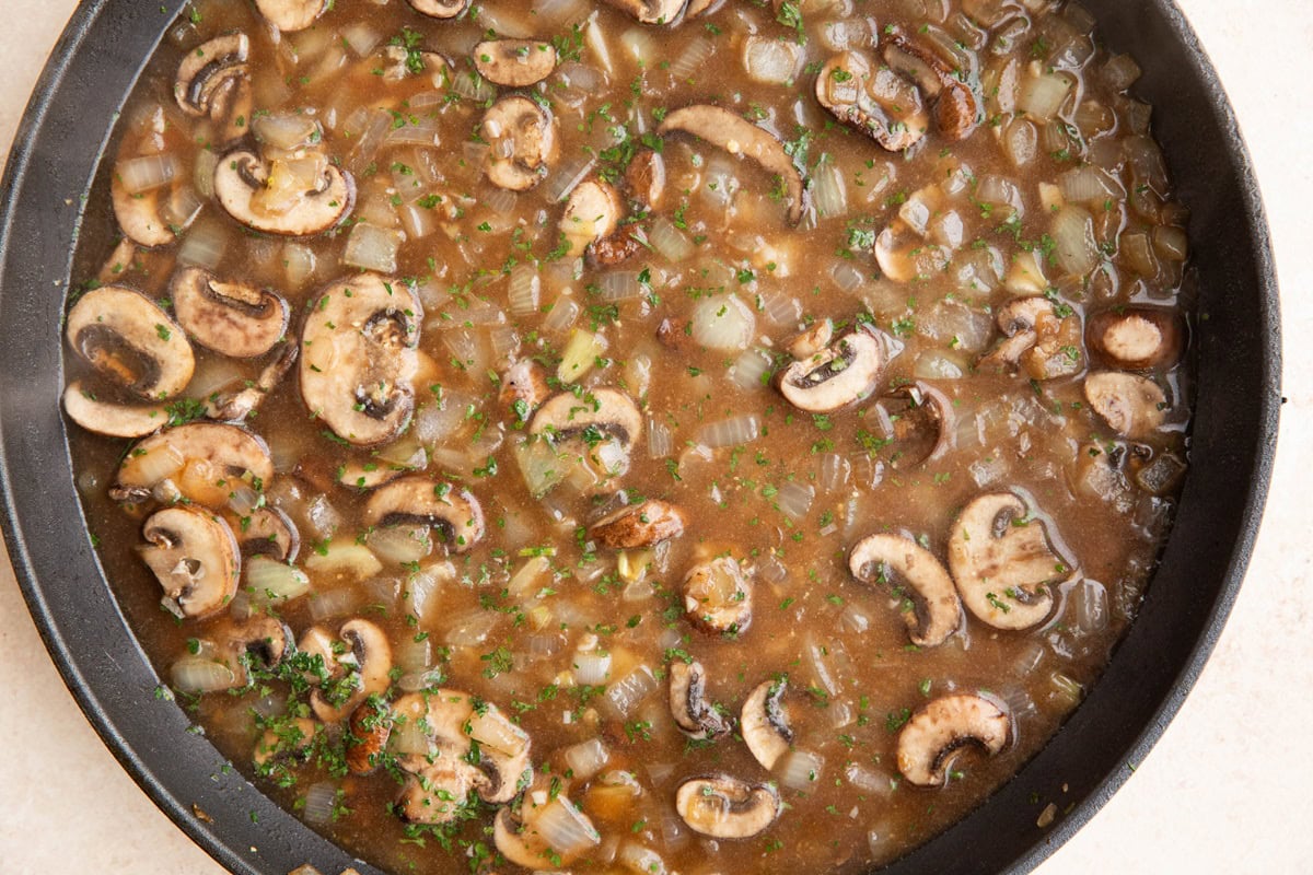 Mushroom gravy in a skillet.