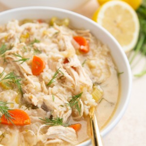 Two white bowls of Greek soup.