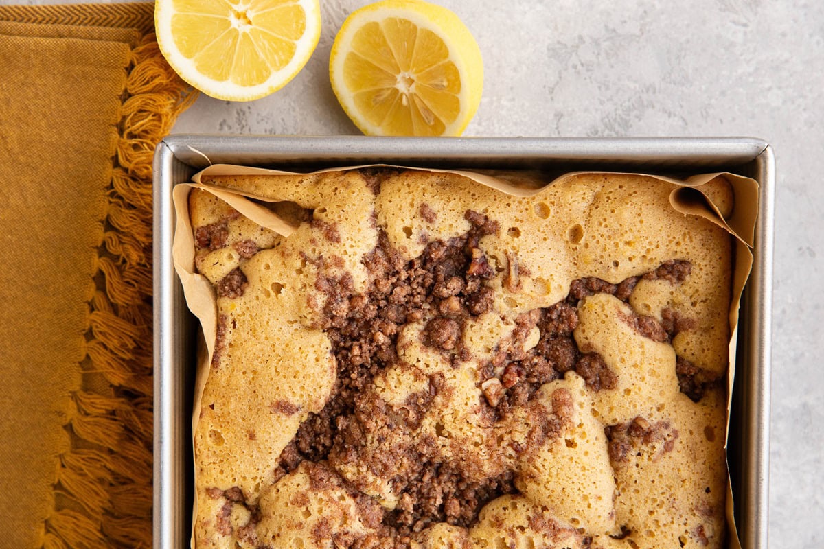 Almond flour lemon coffee cake in a baking dish fresh out of the oven.