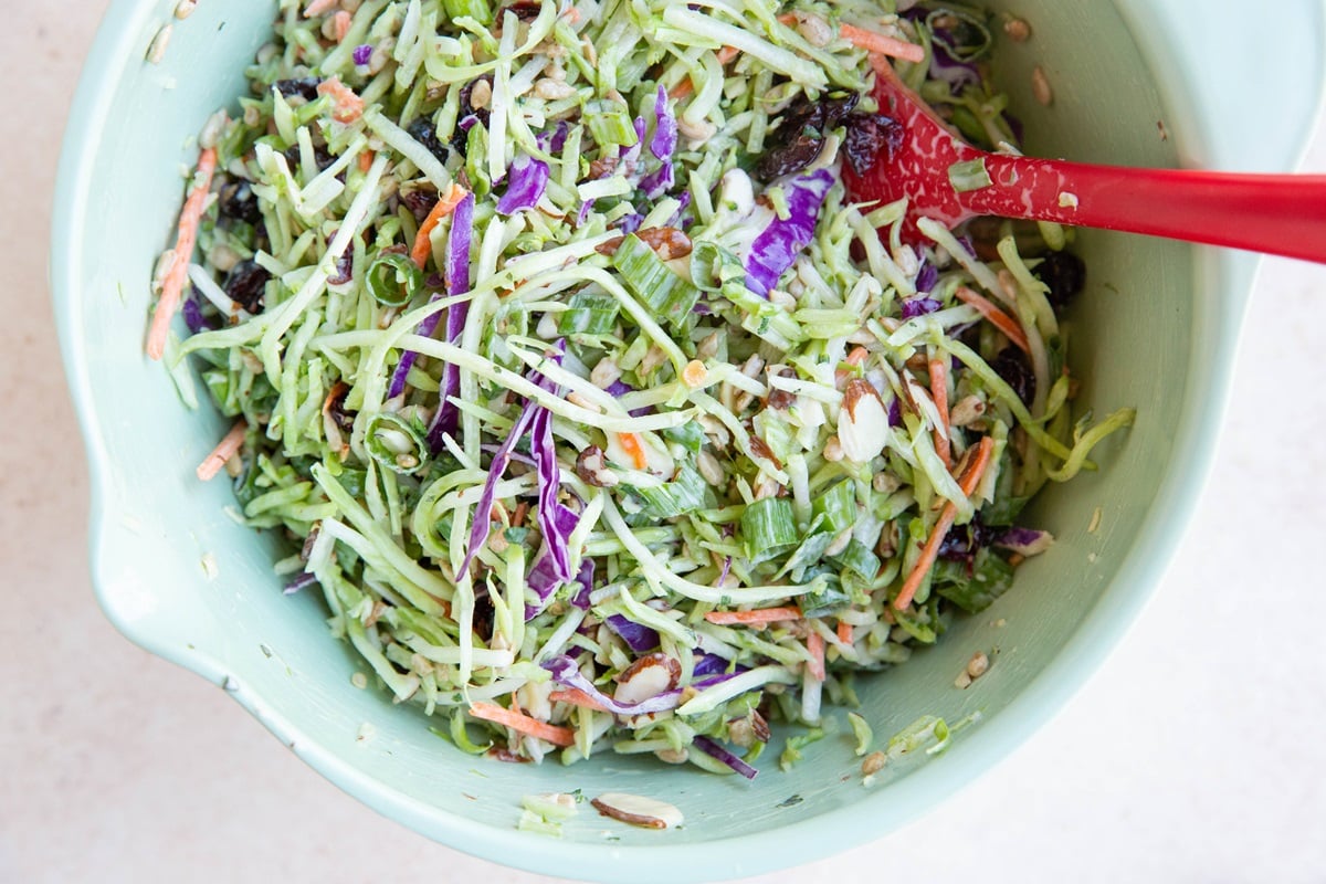 Broccoli coleslaw in a mixing bowl, ready to serve.