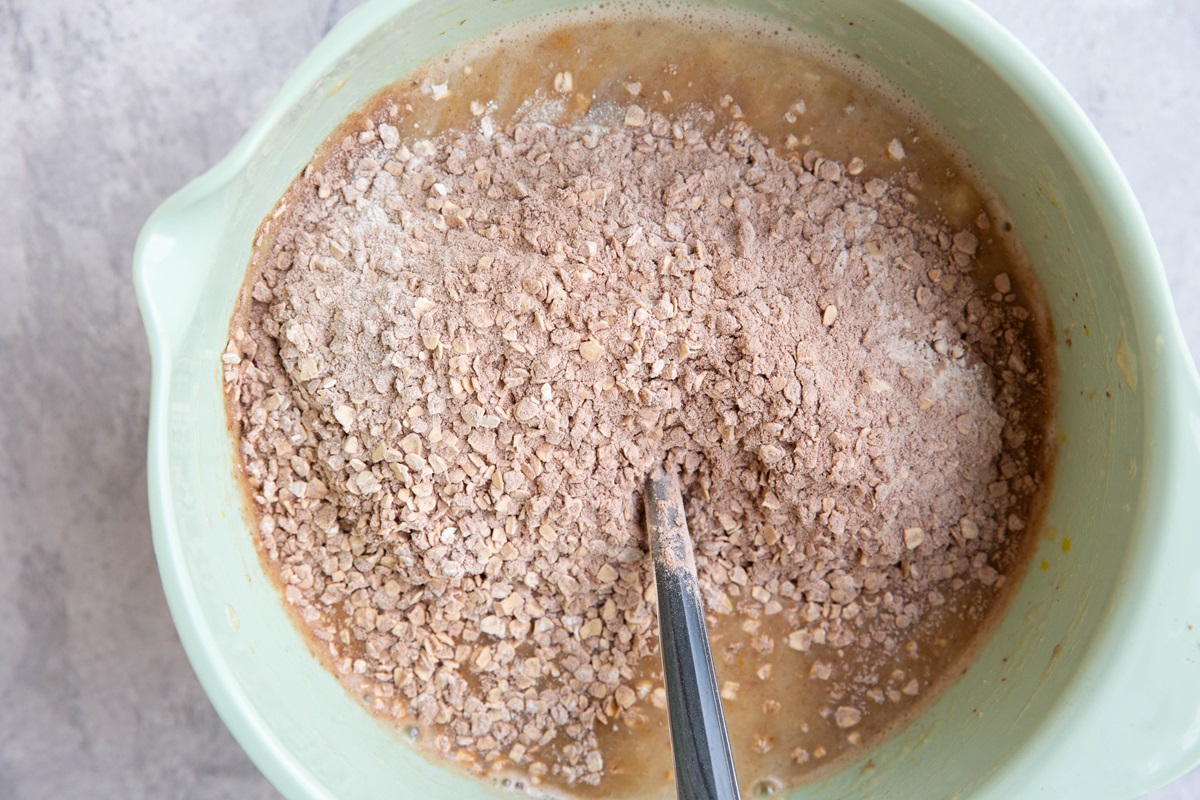 Dry ingredients in the bowl with the wet ingredients to make protein baked oats.