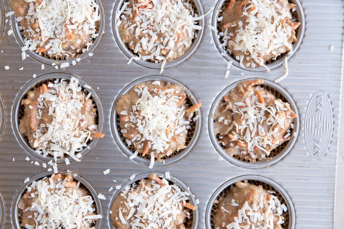 Carrot cake batter in a muffin pan