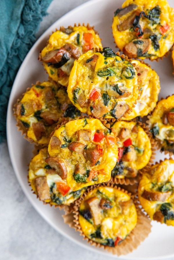 Sausage egg muffins on a white plate, ready to serve.