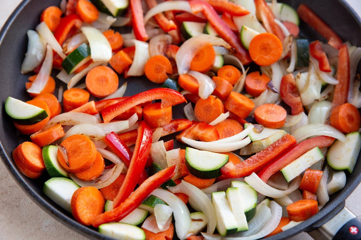 Sauteed vegetables in a skillet.