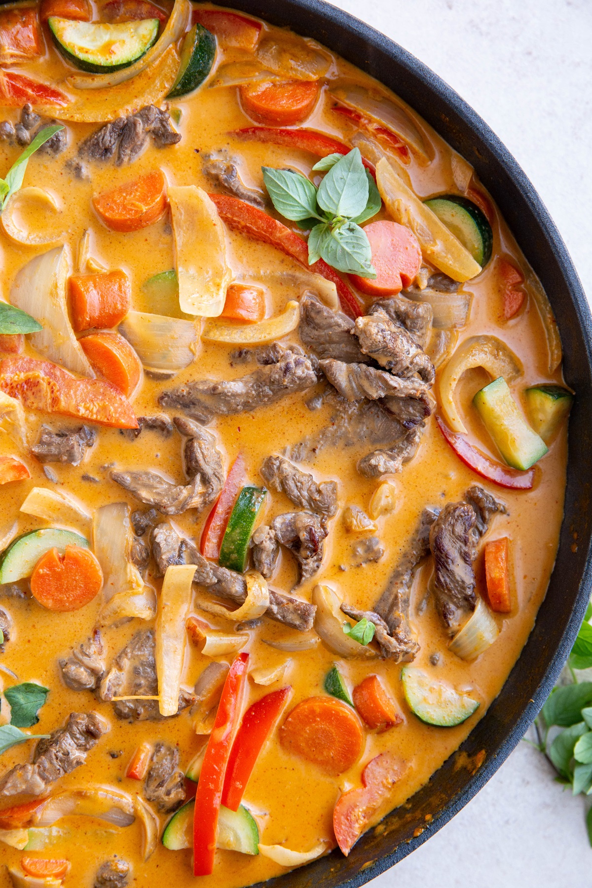 Large skillet of Thai beef curry.