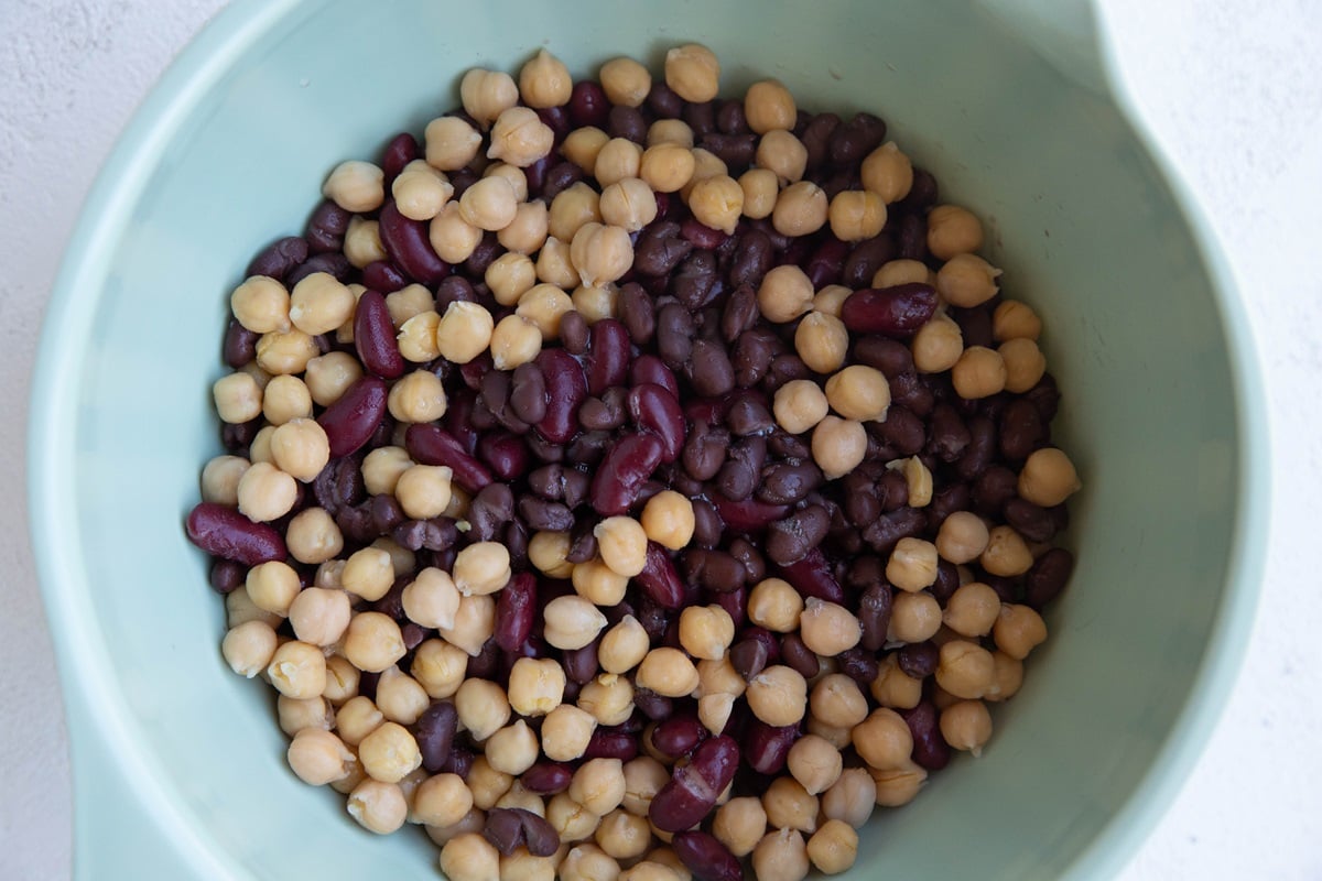 Mixing bowl with beans inside.
