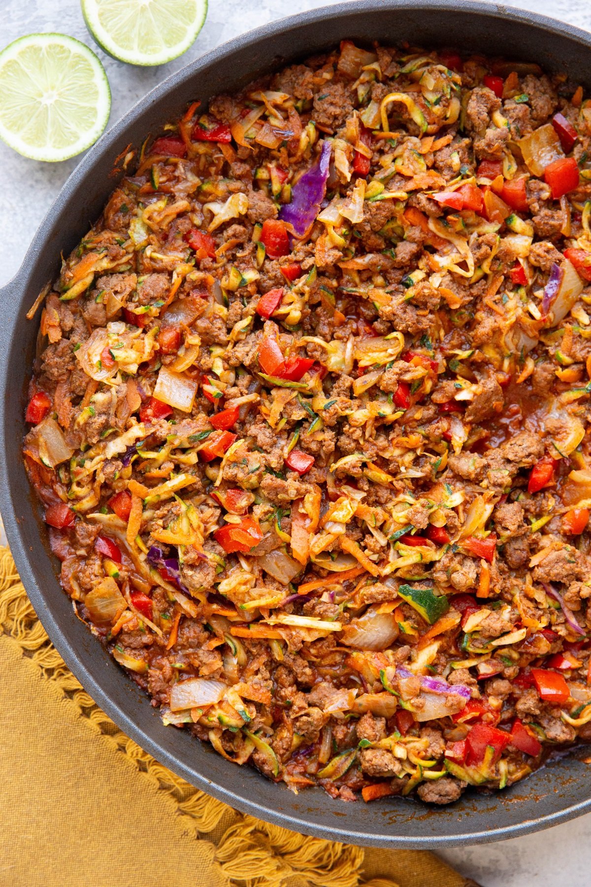 Large skillet with ground beef, vegetables and Mexican-inspired flavors for a high protein low-carb meal.