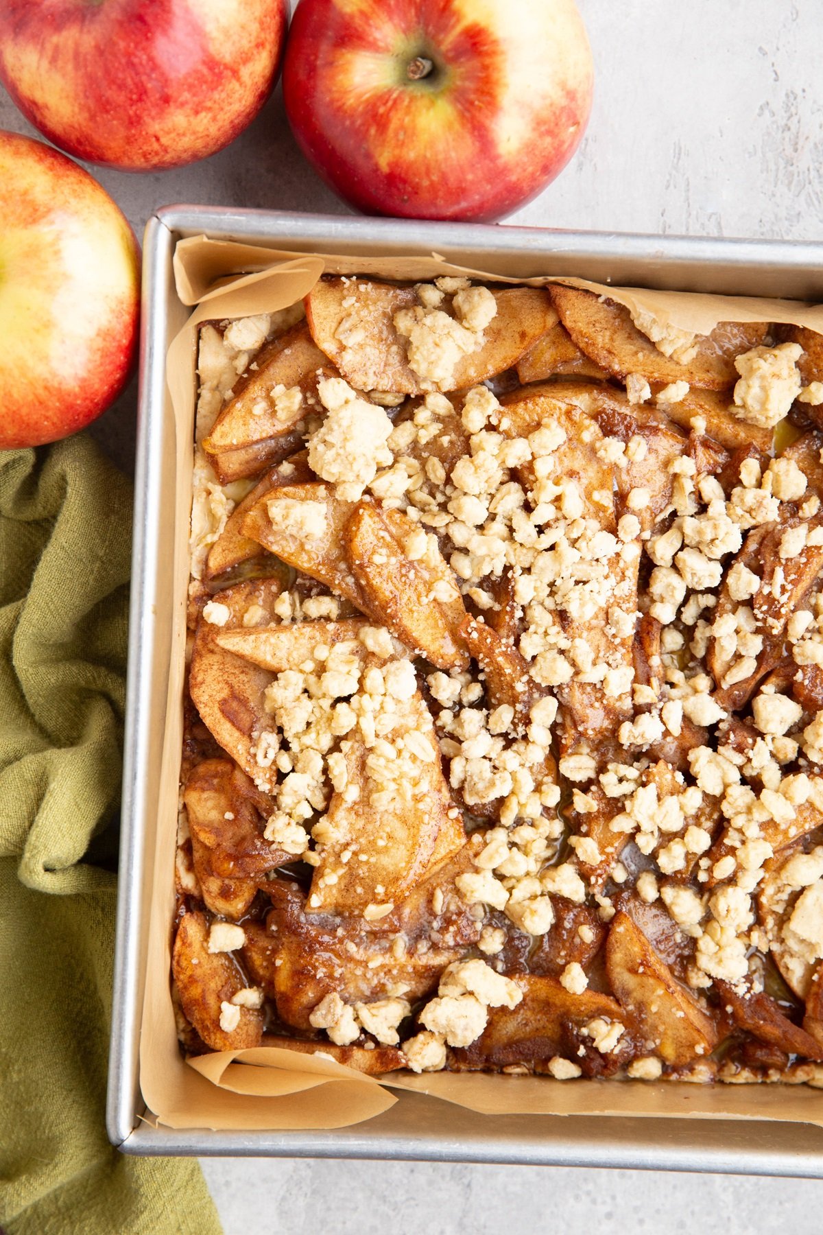 Baking pan with oatmeal apple crumb bars inside, fresh out of the oven and ready to serve.