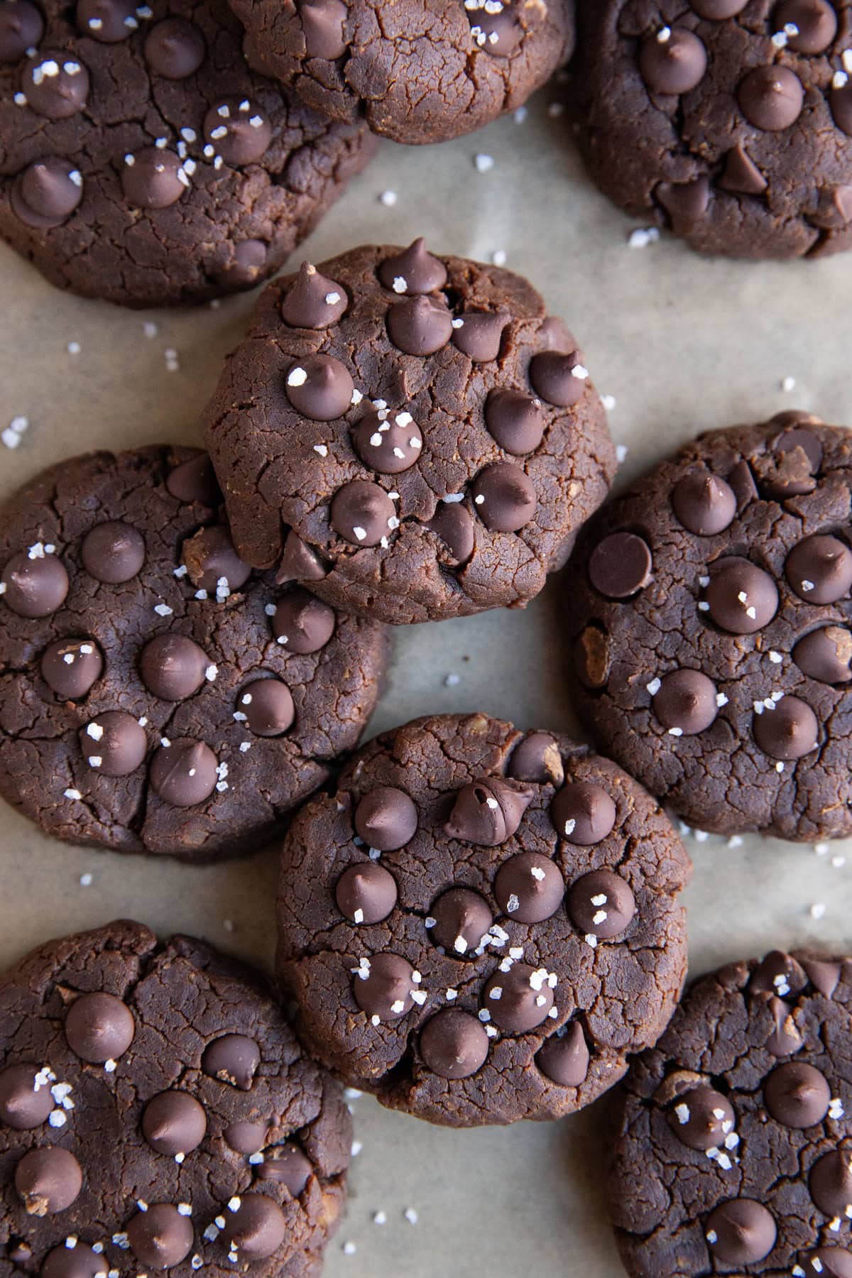 Baking sheet with peanut butter double chocolate chickpea cookies sprinkled with sea salt, fresh out of the oven.