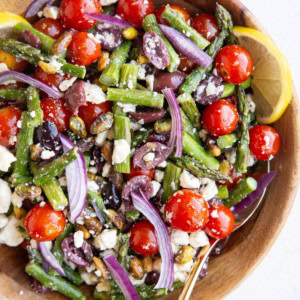 Wooden bowl with asparagus salad inside