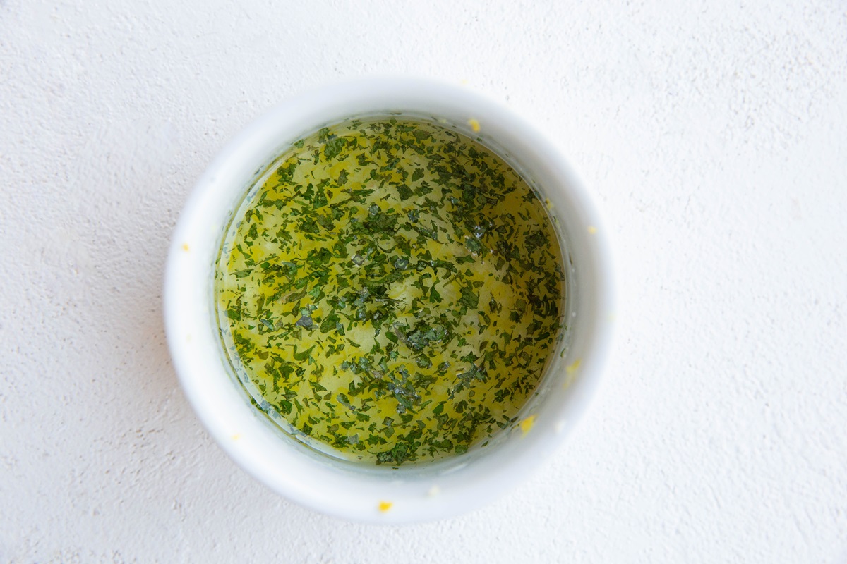 Lemon dressing in a white bowl.