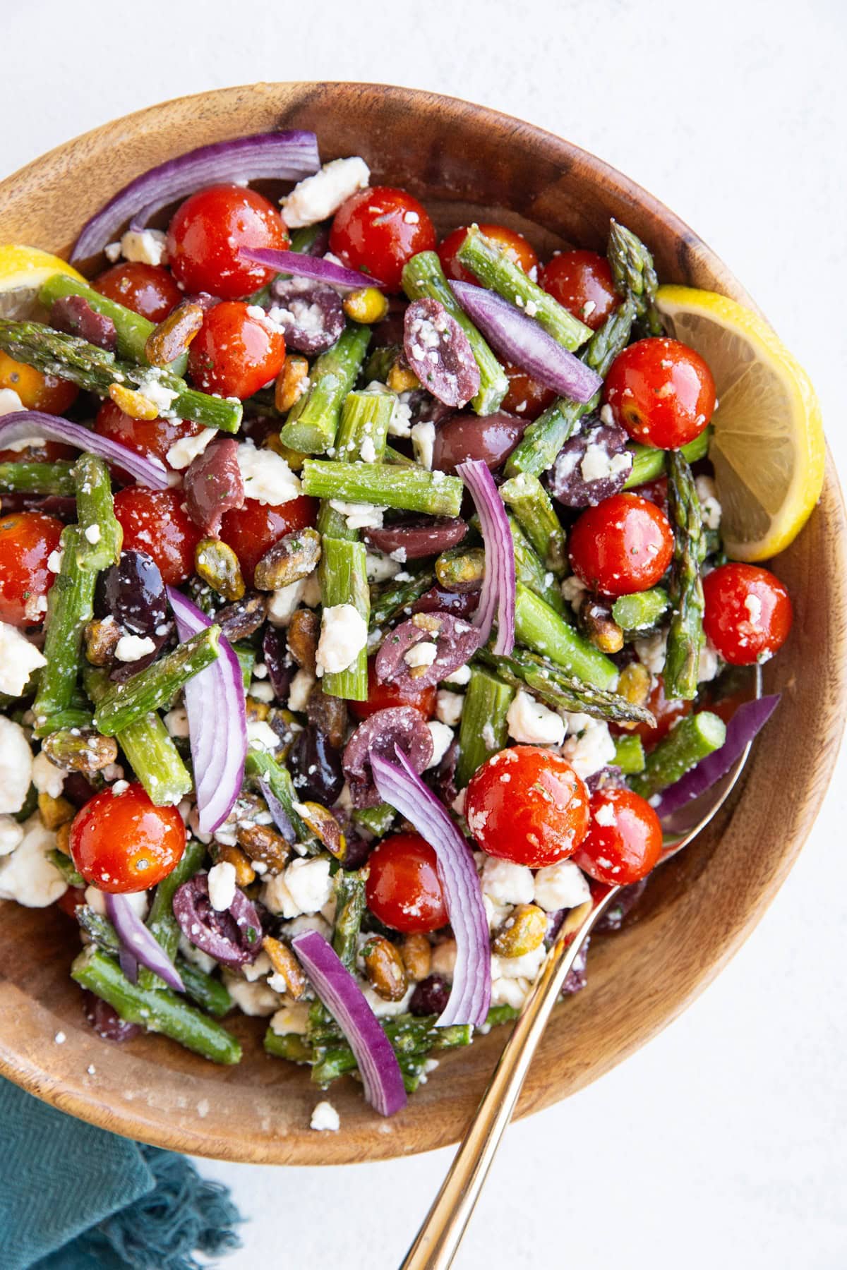 Wooden bowl with asparagus salad inside