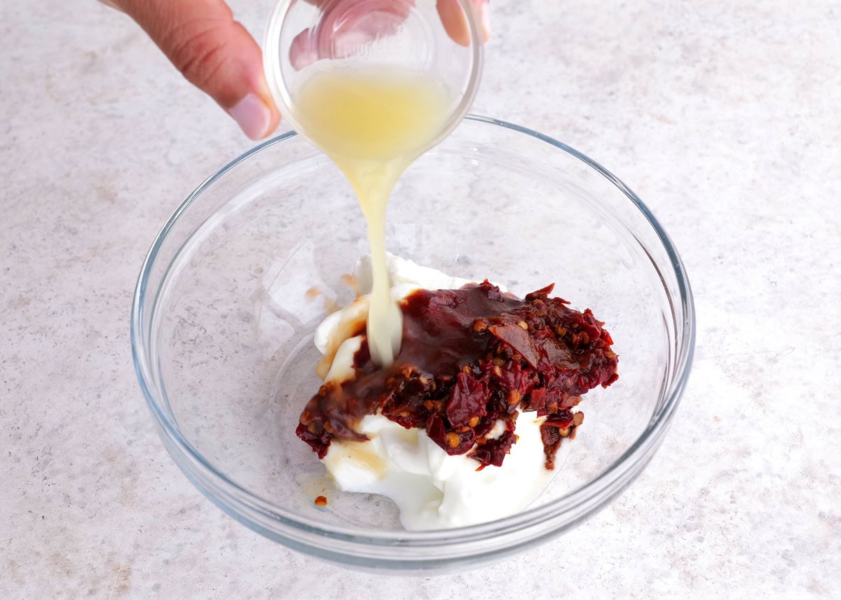 Combining ingredients for chipotle sauce in a small bowl.