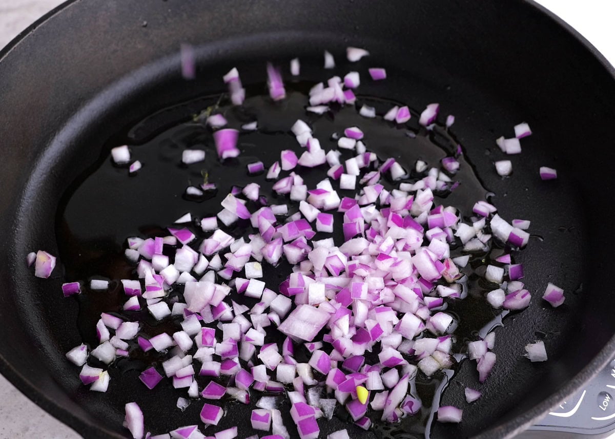 Onion sautéing in a skillet