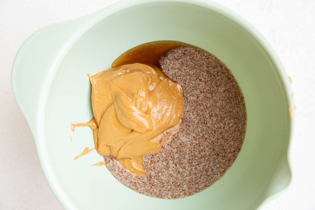 Large mixing bowl with flax eggs, peanut butter, and pure maple syrup.