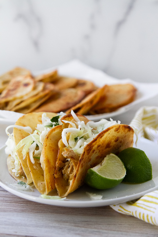 Crispy chicken tacos on a plate
