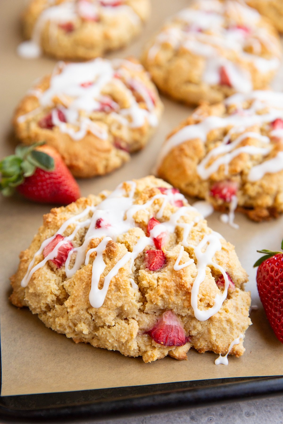 Baking sheet of almond flour strawberry scones fresh out of the oven.