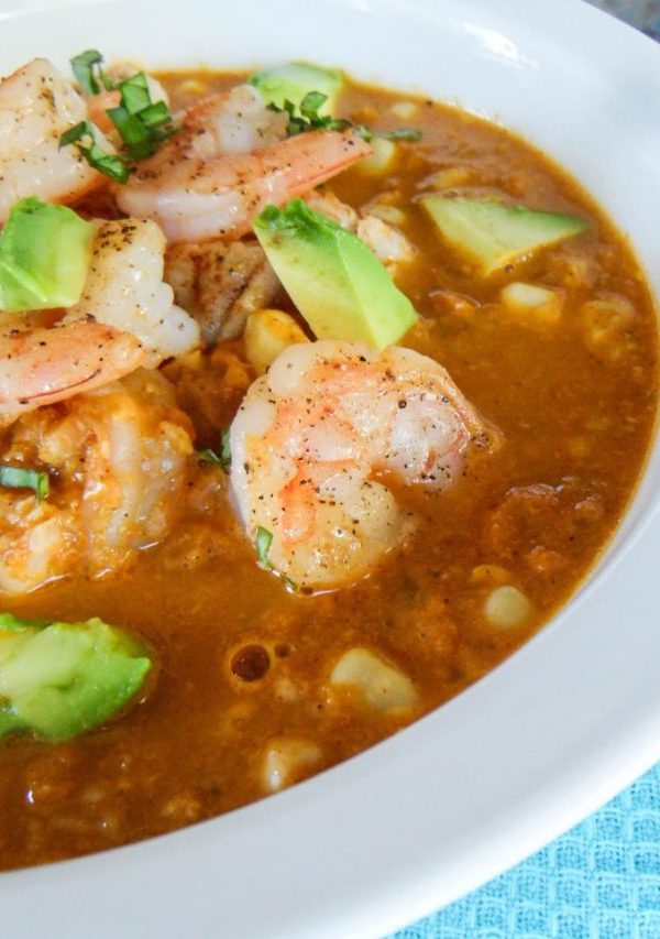 Smokey corn chowder with shrimp and avocado on top.