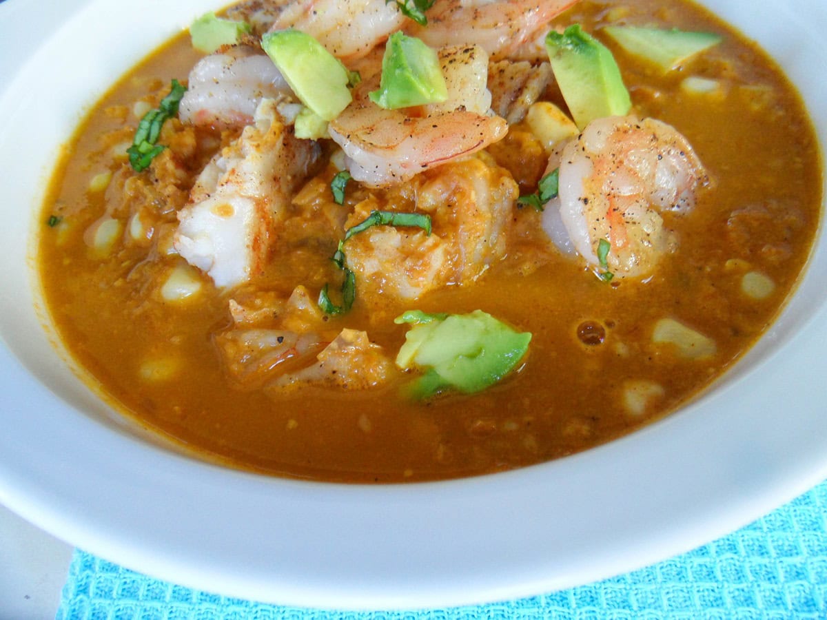White bowl full of shrimp chowder.