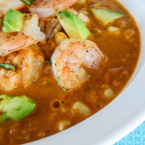 Smokey corn chowder with shrimp and avocado on top.
