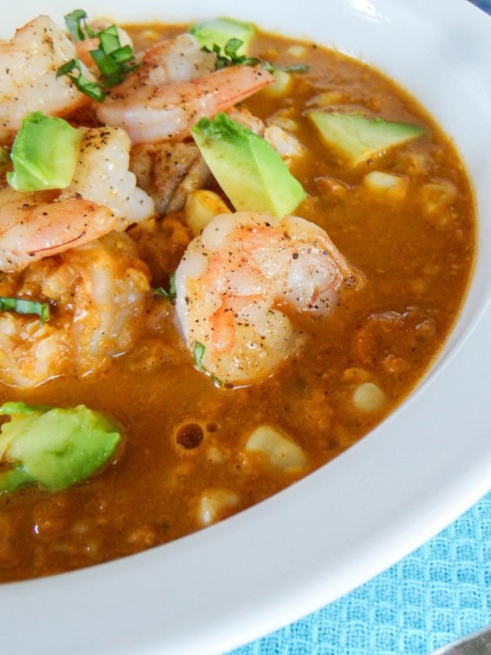 Smokey corn chowder with shrimp and avocado on top.