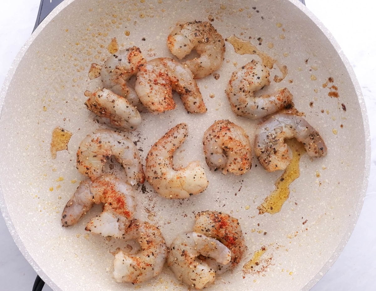 Shrimp sautéing in a skillet