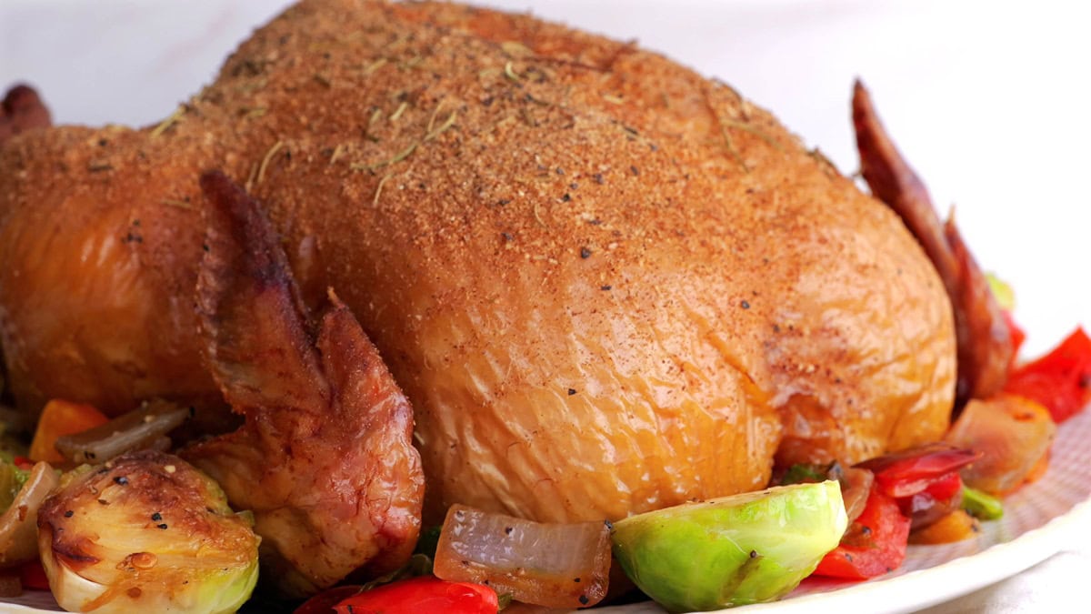 Smoked chicken recipe on a plate, ready to serve.